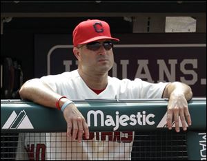 Indians manager Manny Acta watches the team play the Chicago White Sox during the ninth inning Sunday. The Tribe lost 4-2.