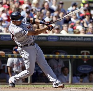 Detroit Tigers' Jhonny Peralta breaks his bat as he connects for an RBI-single during the third inning Sunday.