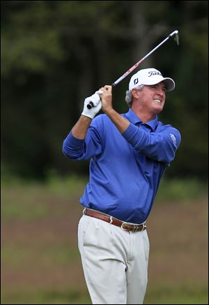 Russ Cochran makes a shot Saturday at the Senior British Open, where he is tied for the lead after three rounds. Cochran and others will have to head for Toledo for another senior major this week.