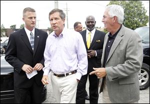 ODOT District Two Deputy Director, Todd Audet, Gov. John Kasich, Toledo Mayor Michael Bell, and Transportation Director Jerry Wray,  arrive for a news conference at ODOT on Douglas Avenue.