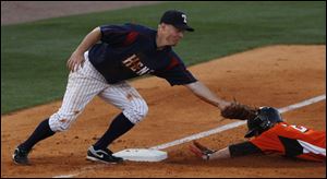Mud Hen Brandon Inge is late on the tag against Norfolk's Kyle Hudson who stole 3rd during Tuesday night.