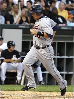 Detroit's Magglio Ordonez scores on a base hit by Victor Martinez in the third inning when the Tigers took a 2-0 lead against Chicago.