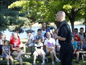Andy Holder, a triathlete who was diagnosed with Type 1 diabetes at age 36, talks to teh campers at Olander Park in Sylvania.