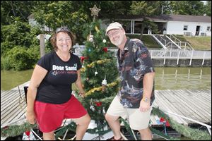 Lynnette and Dave Werning at the Christmas in July boat party at the Maumee River Yacht Club.
