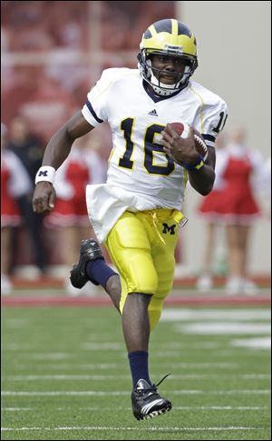 Michigan quarterback Denard Robinson runs 72 yards for a touchdown against Indiana in this Oct. 2, 2010, file photo.