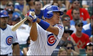 Chicago Cubs' Kosuke Fukudome hits a triple off Houston Astros relief pitcher Sergio Escalona on Saturday in Chicago. 