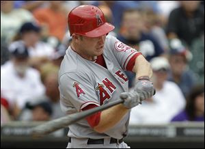 Los Angeles Angels' Mark Trumbo hits a two-run home run during the second inning of a baseball game against Detroit.