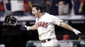Cleveland Indians' Matt LaPorta celebrates as he comes home to get mobbed by teammates after hitting a three run home run off Kansas City Royals relief pitcher Joakim Soria in the ninth inning Saturday.