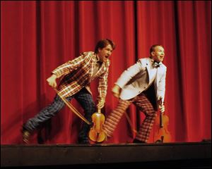 K.C. Kenney, left, as Cosmo Brown adn Joe Dennehy as Don Lockwood in the Croswell production of 'Singin' in the Rain.'
