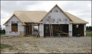 Jim Moline, builder of this Maumee home, says he kept debt low, a lesson he learned in the late 1970s and early 1980s. He is a former president of the Home Builders Association of Greater Toledo Inc.