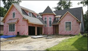 Michael Dean, builder of this house in Sylvania, says he survived the recession partly by focusing on the $500,000-and-up range. 