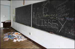 Messages of affection and sadness are left on the chalkboard of a third-floor classroom at Libbey. The building has been nominated for the National Register of Historic Places.