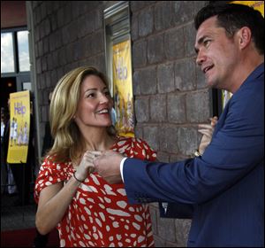Author Kathryn Stockett, left, and director/screenwriter Tate Taylor joke around while speaking to reporters at a benefit screening of ‘The Help’ July 30 in Madison, Miss. The film is based on the New York Times best-selling book by Stockett about the lives of three women in the 1960s Mississippi.