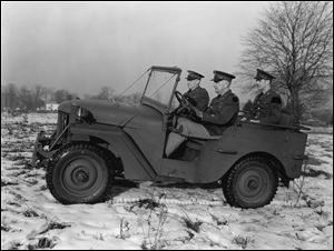 U.S. Army personnel drive a Willys-built Army Jeep in this Dec. 7, 1940, file photo.