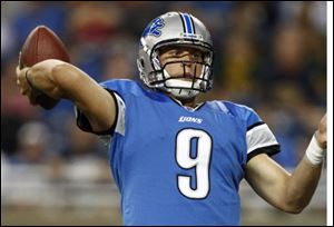 Detroit Lions quarterback Matthew Stafford throws a seven-yard touchdown pass to Nate Burleson against the Cincinnati Bengals during the first quarter of an NFL preseason football game in Detroit.