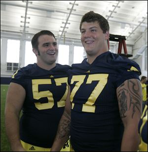 Above, Wauseon’s Elliott Mealer, left, clowns around with fellow lineman Taylor Lewan. 