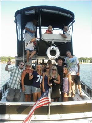 Country singer John Michael Montgomery, wearing a black hat, came aboard Amy and Richard Nearhood's boat and spent some time with them.
