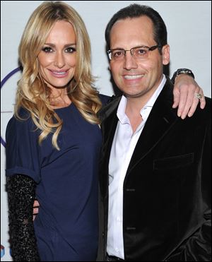 'Real Housewives of Beverly Hills' star Taylor Armstrong, left, and estranged husband Russell Armstrong attend a Super Bowl party in Dallas, Texas, this past February. Russel Armstrong was found dead in his home Tuesday.