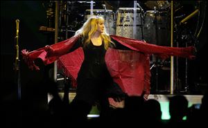 With her trademark shawl, Stevie Nicks twirls around the stage at Huntington Center.
