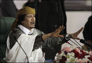 Libyan Leader Moammar Gadhafi, seen here in this March 2011 photo, has disappeared since the rebels made a push toward Tripoli.