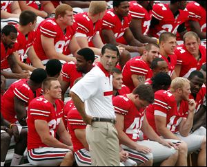 Ohio State coach Luke Fickell waits with his team during yesterday's media day at Ohio Stadium. The Buckeyes open Sept. 3 against Akron.