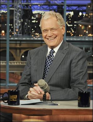 Late-night talk show host David Letterman returns to his show after a two-week vacation and a jihadist Web site made a death threat against him.
