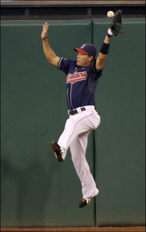 Cleveland Indians center fielder Kosuke Fukudome can't handle a ball hit by Seattle Mariners' Wily Mo Pena in the fourth inning of the second game of a doubleheader.