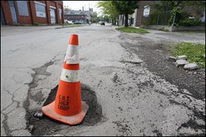 A pothole on West Delaware Avenue in Toledo.