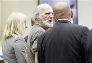 Robert Bowman reacts after hearing jurors were unable to reach a verdict in his trial. He is charged with murder in the 1967 death of 14-year-old Eileen Adams.