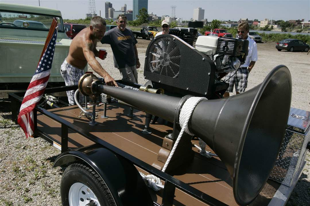 Larry-Cooper-examines-horn-from-old-steamship