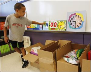 Devon Sanders checks his Beverly classroom. Many students and teachers spent time in temporary spaces.