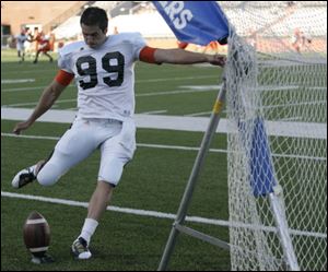 Kicker Kyle Burkhardt practices kicking during Bowling Green University football scrimmage.
