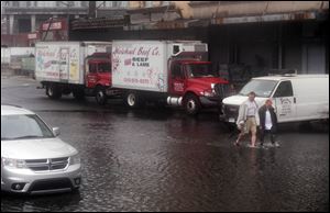 In New York City’s Meatpacking District, Irene lightly flooded 10th Avenue. In many areas, standing water was quickly receding.
