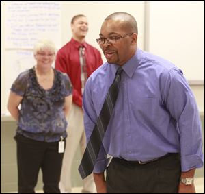 Principal Anthony Bronaugh, picked from Sherman
Elementary, addresses students as classes open.