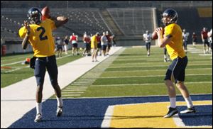 Austin Dantin, right, will start at quarterback for Toledo, but Terrance Owens, left, will play as well.