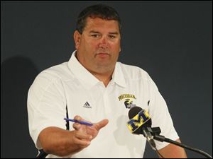 University of Michigan football head coach Brady Hoke gave his players trident pitchforks like pins given to Navy SEALs.