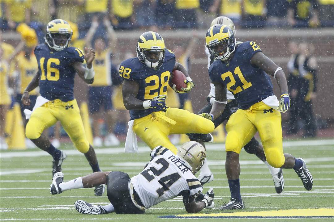 Michigan-Fitzgerald-Toussaint-caught-by-Lewis-Toler