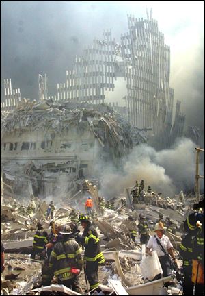 A shell of what was once part of the facade of one of the twin towers of New York's World Trade Center rises above the rubble that remains after both towers were destroyed in the terrorist attacks Sept. 11, 2001.