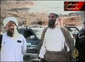 Osama bin Laden is shown at an undisclosed location on Sept. 11, 2001, in this video image released by Al-Jazeera television Oct. 5, 2001. Al-Jazeera did not say whether the image was taken before or after the Sept. 11 attacks on the United States or how it was obtained. At left is Bin Laden's top lieutenant, Egyptian Ayman al-Zawahri. Graphic at top right reads 