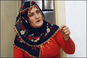  Naciye Tokova, a Kurdish mother and housewife, who was sentenced to seven years in jail for helping rebels who are described by Turkey as terrorists, speaks during a July interview in her home in Kurtalan, Siirt in southeastern Turkey. The key piece of evidence against Tokova, who is illiterate, was the sign that she held up at a protest. It said: 