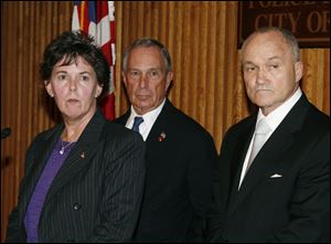 Janice Fedarcyk, left, assistant director of the FBI's New York office, Mayor Michael Bloomberg, center, and Police Commissioner Raymond Kelly hold a news conference Thursday in New York. They announced a terror threat has been made against New York and Washington. 