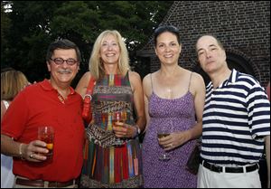 Allan Rubin, from left, Sandra Hylant, Susan Block, and Allan Block attend the Art and Autism charity event.