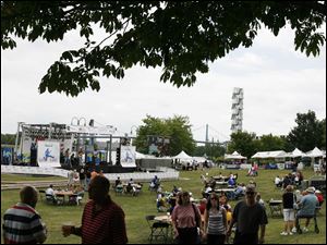 People have fun at The Red, White & Kaboom Fireworks with the Taste of Toledo at Promenade Park.
