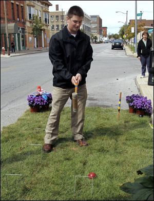  Businesses and schools take up parking spaces for Park(ing) Day on Adams Street in downtown Toledo, Ohio. This is Manhattan's space, a boat/dock theme.