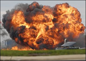 A single engine T-28 from the six-plane Trojan Horsemen Demonstration Flight Team crashes and explodes during a performance at the Thunder Over the Blue Ridge Open House and Air Show, Saturday,  at the 167th Airlift Wing in Martinsburg, W.Va