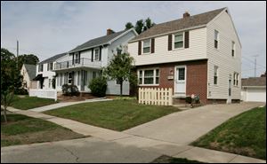 The house at 1496 Gould Rd. in West Toledo, right, is among those reported to be renovated by Shayla Bell’s company, Fort Industry Development LLC. It was started in early 2010 and soon was approved to receive federal funds.