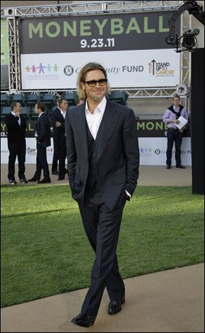 Brad Pitt arrives at the Paramount Theatre of the Arts for the premiere screening of the movie 