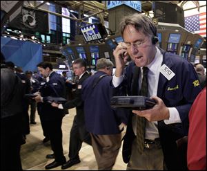 Trader Joseph Chirico works on the floor of the New York Stock Exchange. 