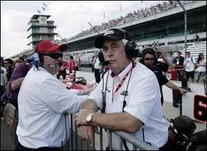 Car owners Roger Penske, right, and Chip Ganassi look on during the first day of qualifications for the Indianapolis 500 auto race at the Indianapolis Motor Speedway in Indianapolis in this May 22, 2010, file photo.