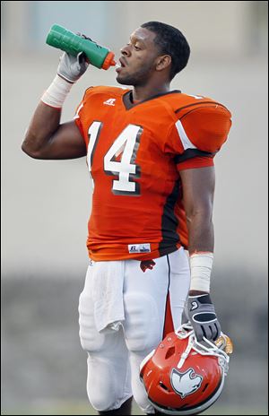 Southview player Allen Gant cools off during a timeout in a game with St. Francis at the Glass Bowl, Friday, August 26, 2011.